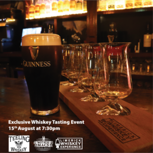 A creamy pint of guinness beside irish whiskey glasses with the label Limerick Whiskey Experience. Teeling Whiskey Tasting at Mother Macs Public House Limerick on 15th Aug 2024.
