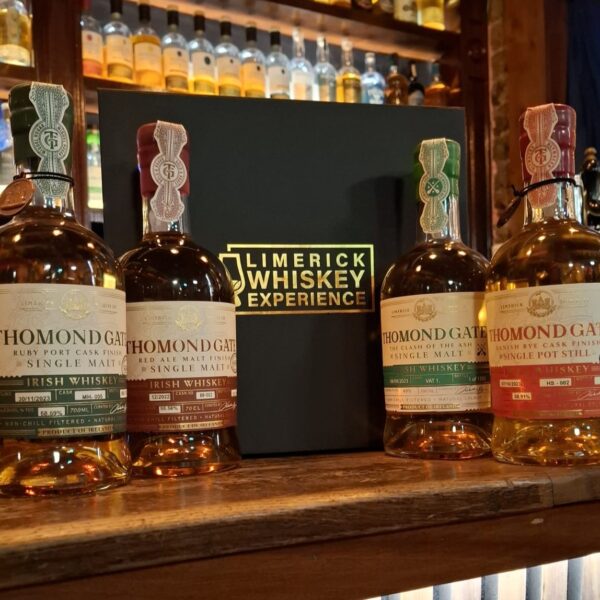 4 bottles of Thomondgate IRish Whiskey on a bar counter with a luxury gift box labelled Limerick Whiskey Experience