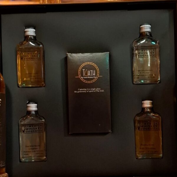 Luxury whiskey gift box with 4 glass bottles and a branded tuath glass